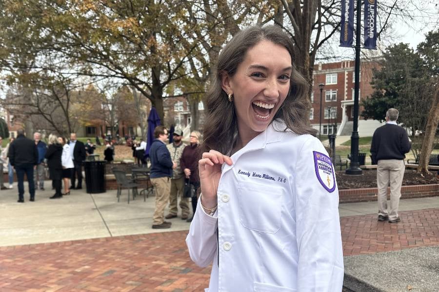 Photo of Kennedy Moore-Williams in white coat. 