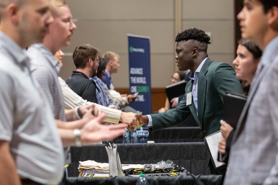 Students meeting employers at a past Career Fair