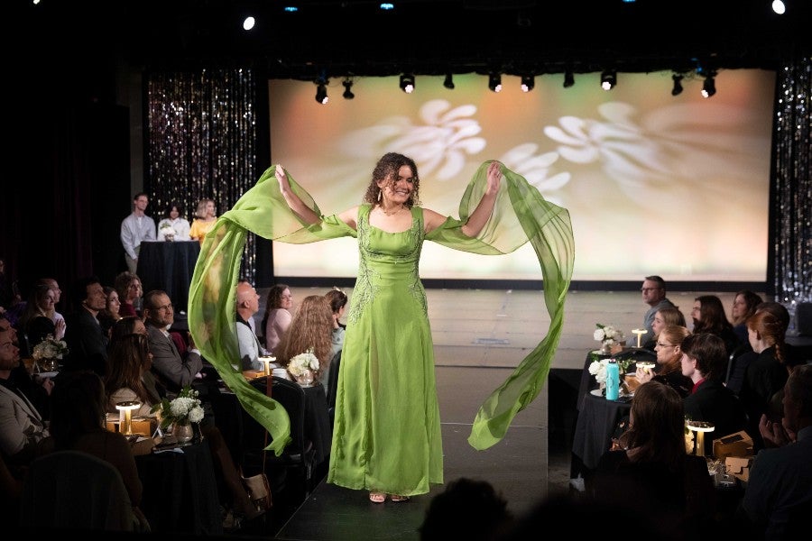 Student model walking the runway in the 2023 student fashion show