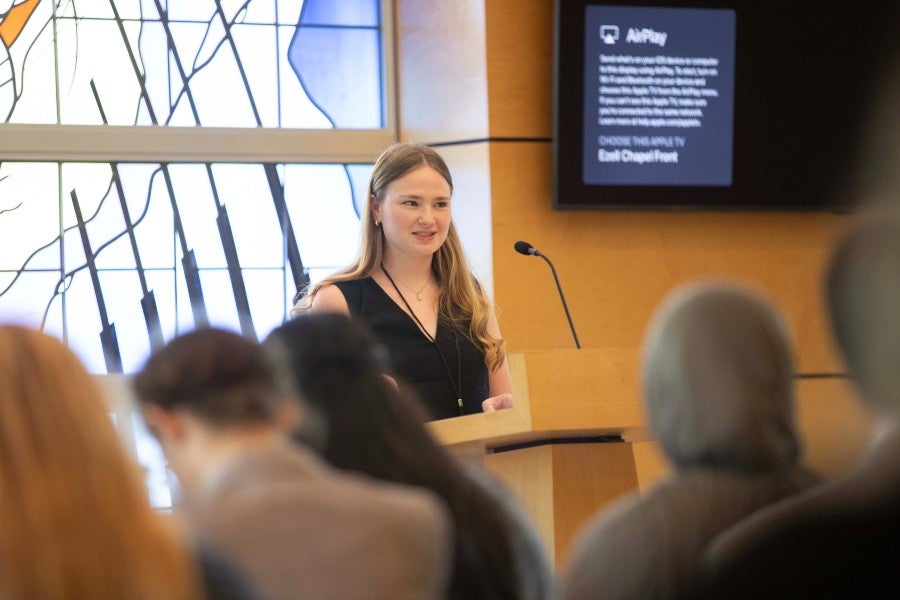 Allison Aardsma reading poetry at the Student Scholars Symposium