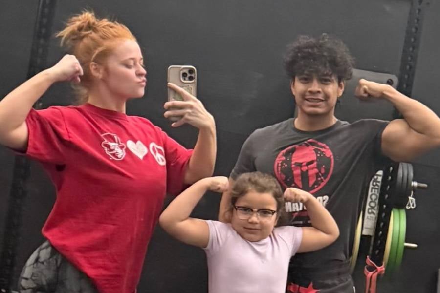 Otilio Torres Davila and daughter in a gym. 