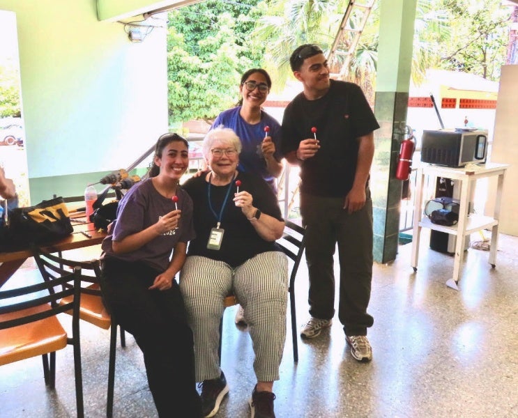 Mary Ann with 3 students