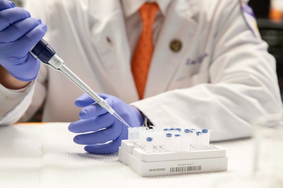 a pharmaceutical researcher working with samples