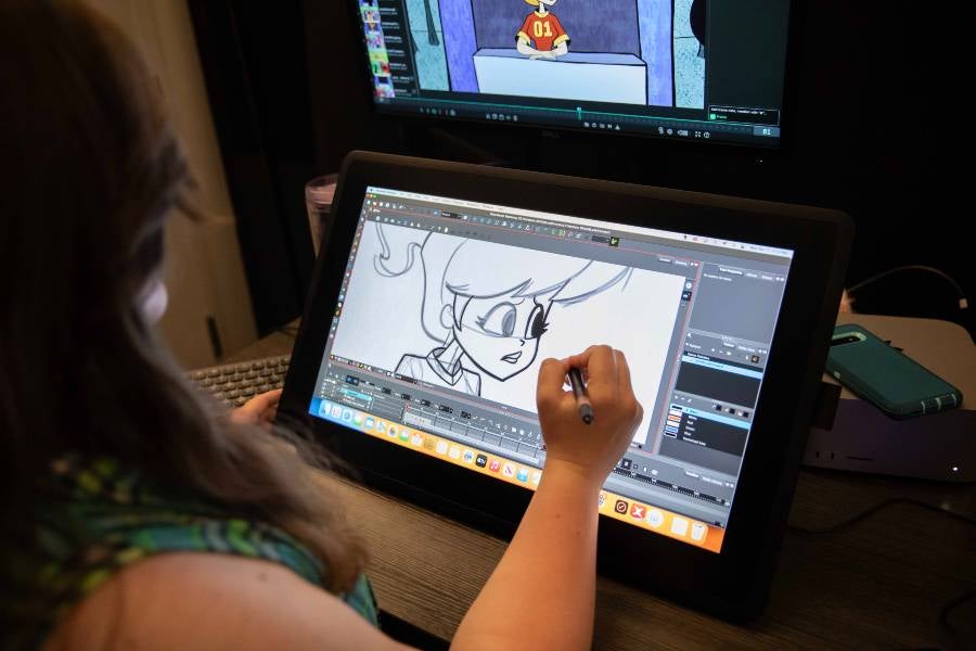 Lipscomb student creating animation on a computer screen. 