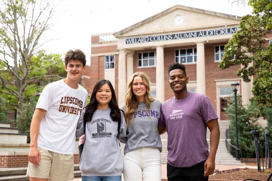 Four Lipscomb students standing in front of Collins Alumni Auditorium
