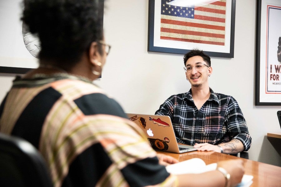 military-connected students conversing in the veterans lounge