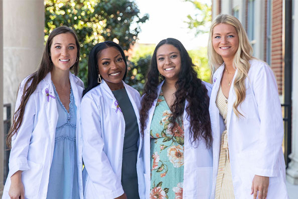 four female nutrition students smiling