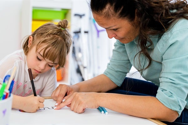 educator and child reading