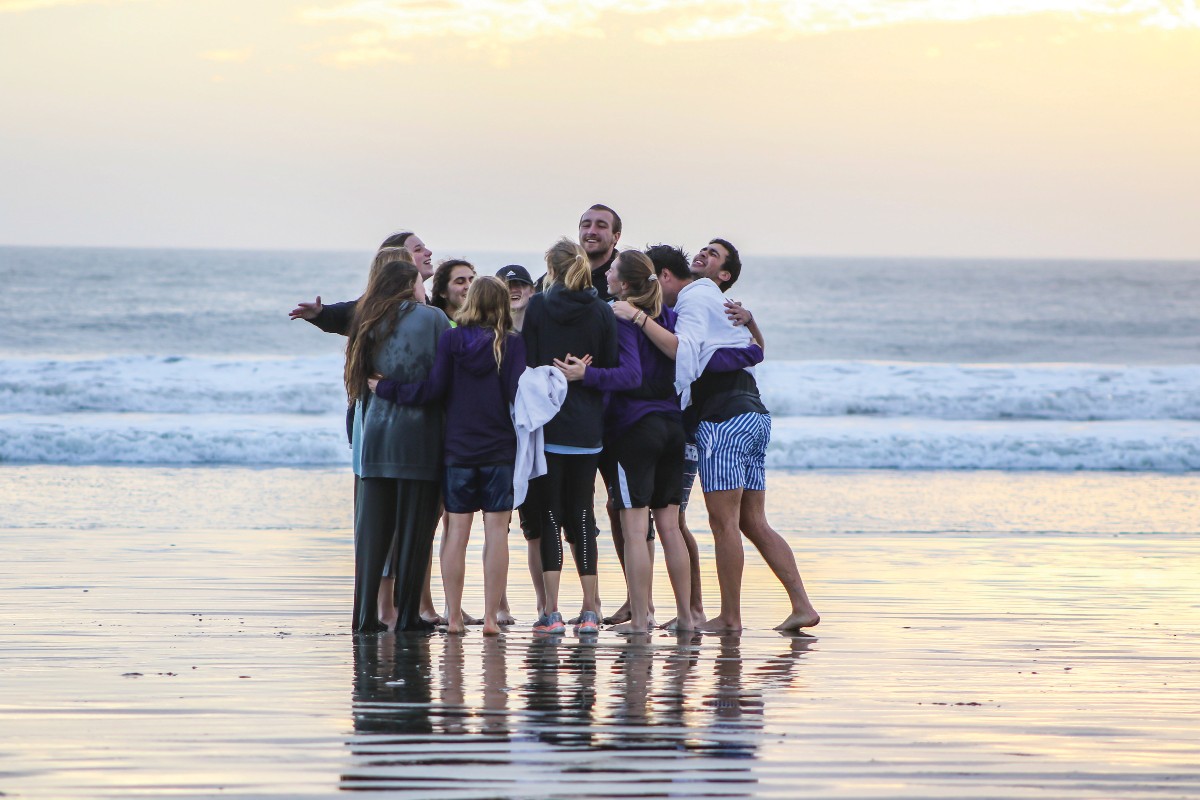 Student Athletes worshipping on the beach on a mission trip to Baja Mexico