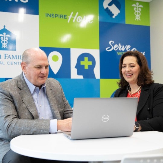 Phil Ellenburg and Sherry Mast working together in the clinic's employee break room