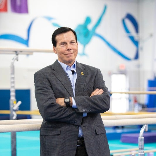 portrait of Drew Davis in a gymnastics gym 