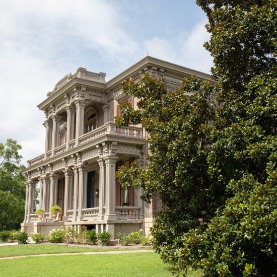 the Two Rivers Mansion from the side with greenery