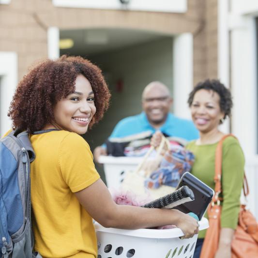 A student moves in with help from her parents.