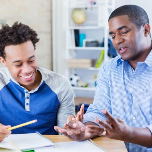 parent helping child with college application