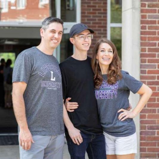 student with his parents