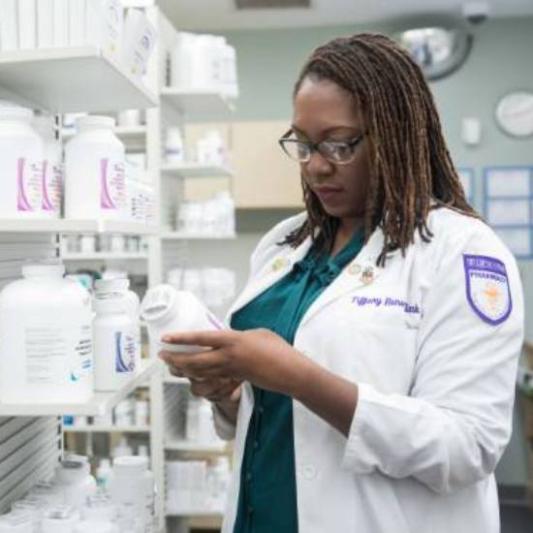 student working in a pharmacy
