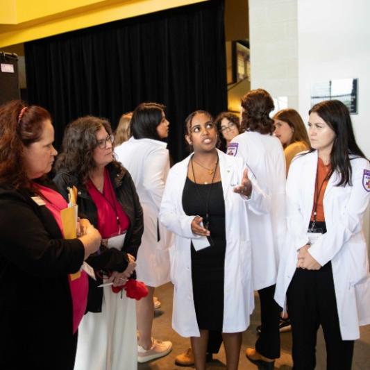 Nursing students presenting at the symposium