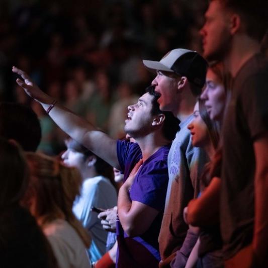 Student in worship during chapel