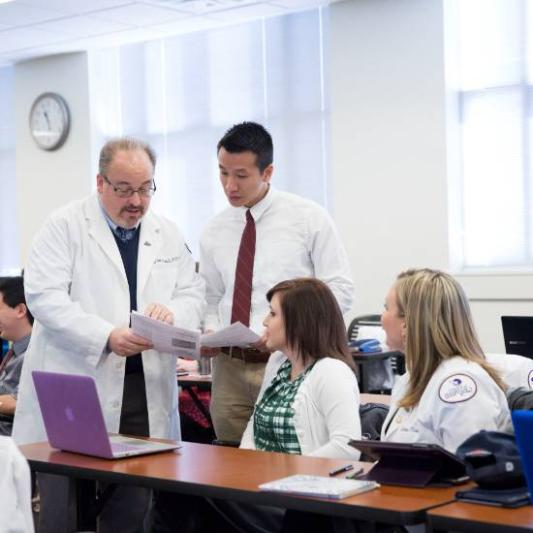 student and teacher in the pharmacy lab