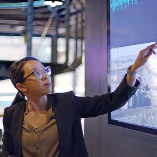 teacher pointing at the screen