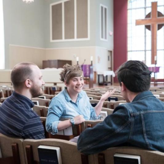 Students in small study group asking questions