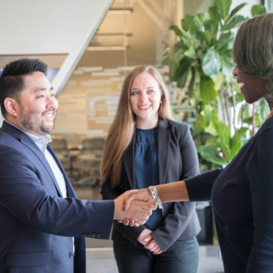 Student shaking professor's hand