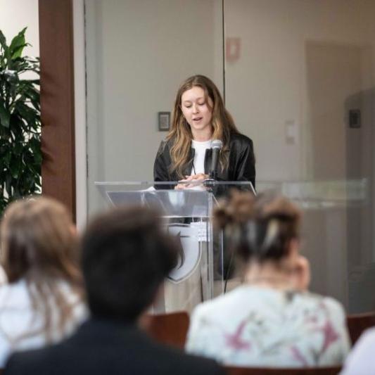 Student speaking at Student Scholar Symposium