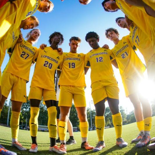 Soccer players in a huddle