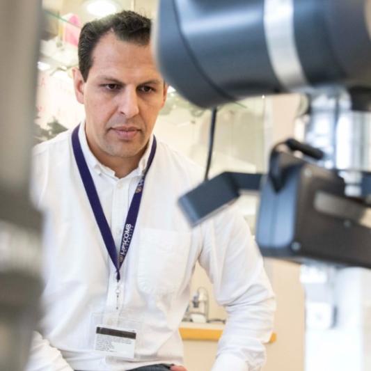 Juan Rojas working with the Franka robot arm