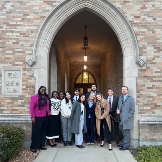 mock trial students in a group smiling