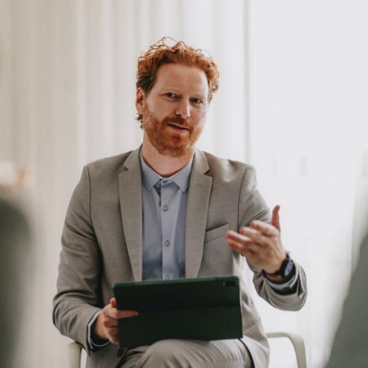 Businessman in a meeting giving a presentation