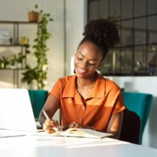 Female student studying in her living room.
