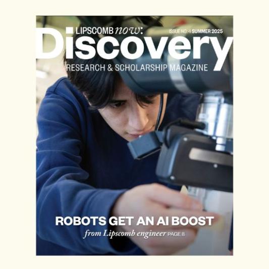 Magazine cover with student working with a robot