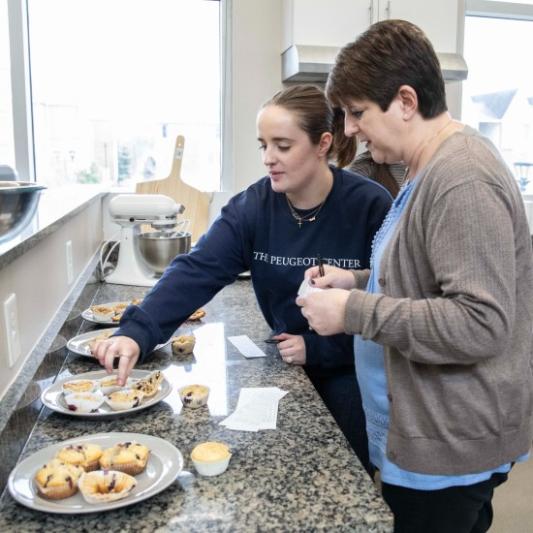 University staff taste testing the experimental food by nutrition students