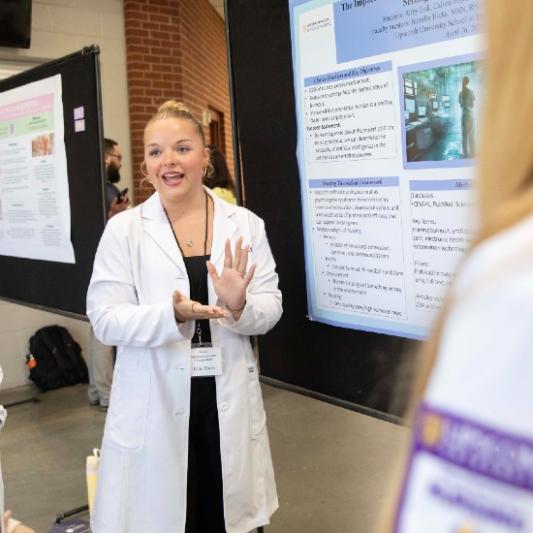 Student nurse presenting at Student Scholars Symposium