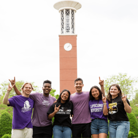 Students posing by the Lipscomb belltower in Lipscomb merch