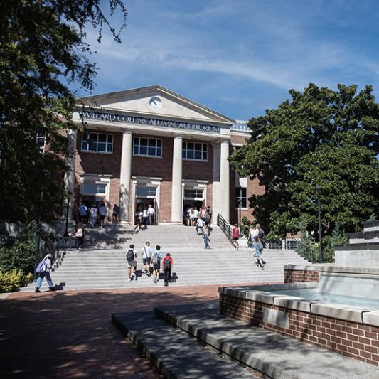 Students walking out of Collins. 