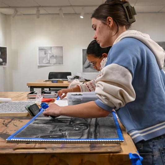 students working on charcoal art