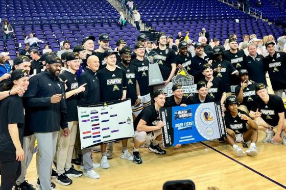 The Bisons with the ASUN championship trophy.