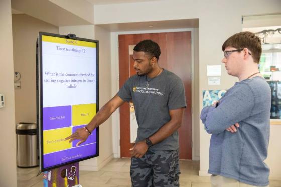 Justin Alexander demonstrates LUKE to an onlooker. 