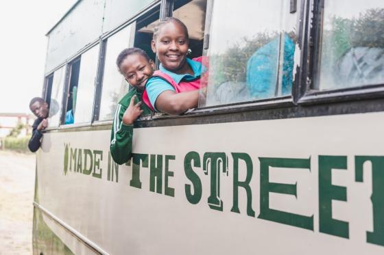 Students in the Made in the Streets program on a bus