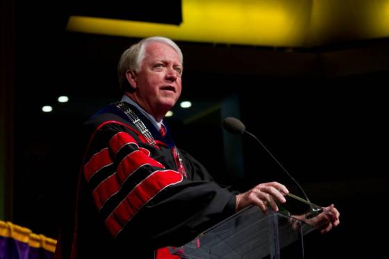 Mike Adams in doctoral regalia speaking at President's Convocation