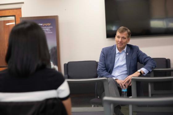 Dr. Allen Sills talking with students one-on-one