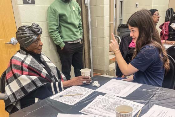 Student nurse conducting a health screening with a senior participant at the Hadley Park Center