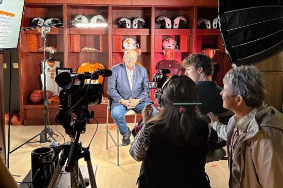 Students filming an interview with former Tennessee football coach Phil Fulmer. 