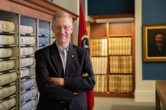 portrait of Ken Fieth in front of shelves of records books in the Metro Nashville Archives