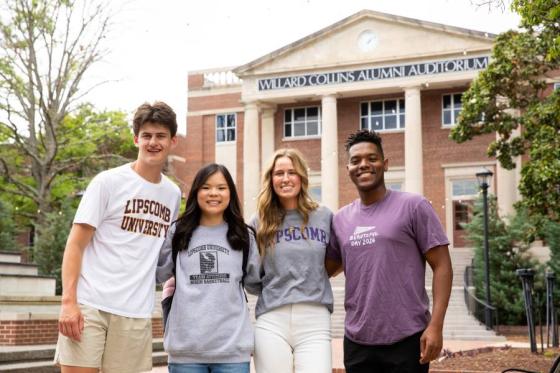 Four Lipscomb students standing in front of Collins Alumni Auditorium