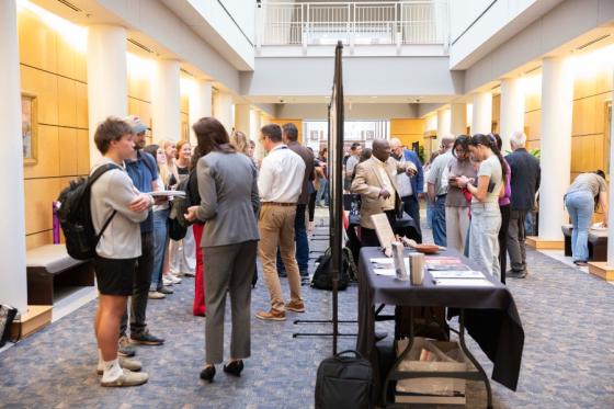 faculty presenting their research to students at the Faculty Research Day