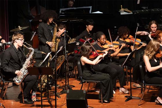 Students playing strings and horns