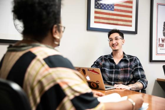 military-connected students conversing in the veterans lounge